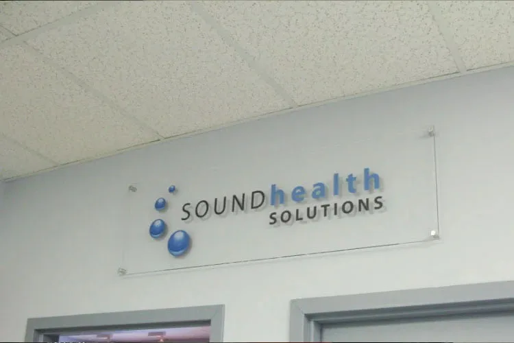 Clear acrylic on standoffs with printed vinyl graphics